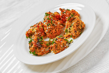 bang bang broccoli bites on plate, top view