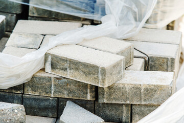 Dismantled paving stones folded for disposal. Material for paving streets and footpaths. Close-up. selective focus