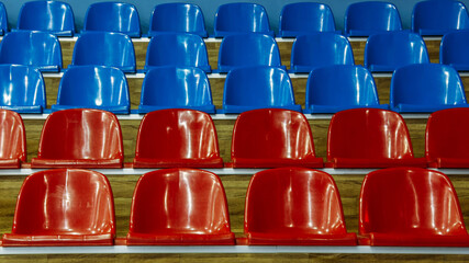 Naklejka premium Plastic chairs at stadium