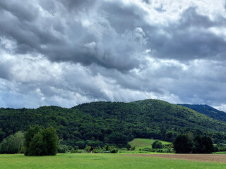 Sky before storm - dark gray clouds over Pohorje Mountains. Green Slovenia.