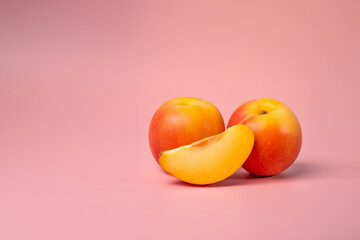 Peach fruit on a solid color background. Isolated object in photo studio. Commercial shot with copyspace.