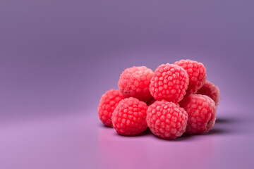 Raspberry fruit on a solid color background. Isolated object in photo studio. Commercial shot with copyspace.