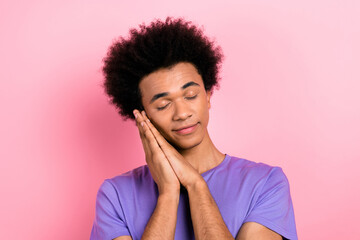 Fototapeta na wymiar Photo of dreamy calm nice man wear stylish clothes two arms touch cheeks enjoy sweet dreams sleep isolated on pink color background