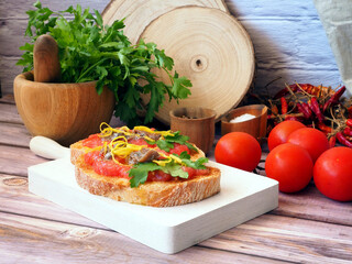 Tostadas with Tomatoes, Anchovies, and Lemon Zest