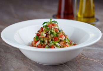Fresh finely chopped shepherd salad on a bowl