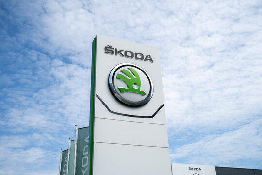 Skoda car logo, vehicle dealership pylon signboard with corporation brand logotype. Czech automobile manufacturer, automotive company, Škoda auto salon sign on August 12, 2023 in Krakow, Poland.
