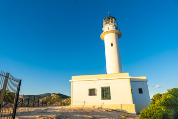 White lighthouse or Cape Ducato Lefkas at sunset in the southern area of the island of Lefkada....