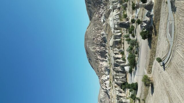 Cappadocia. Fairy chimneys. Famous rocks in Zelve pasabaglari open air museum. aerial drone view. Vertical shot. story format