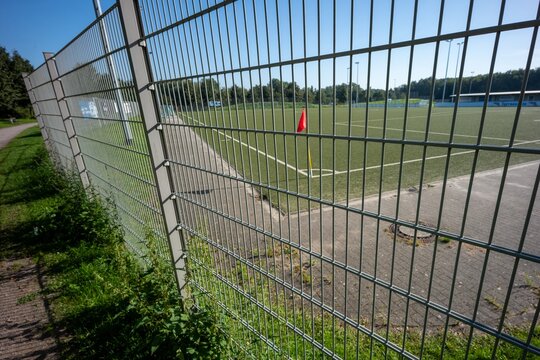 Metal fence barrier football field