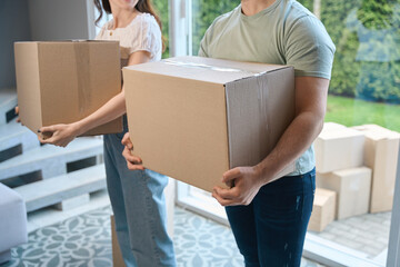 Young beautiful couple moving into new house