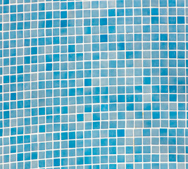 Small blue tile tiles on the wall. Texture