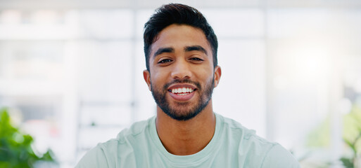 Naklejka premium Face, smile and business man in office with pride for career, job or occupation. Portrait, professional and happy, confident and proud male entrepreneur from India with success mindset in workplace.