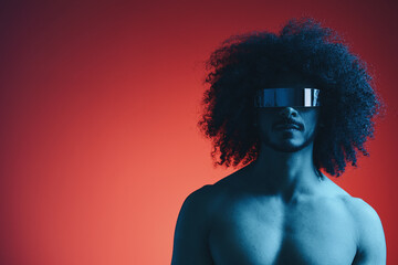 Portrait of fashion man with curly hair on red background with stylish glasses, multinational,...
