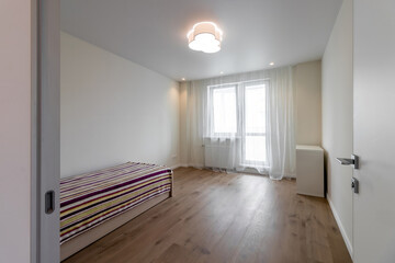 The interior of an empty modern apartment in bright colors immediately after renovation