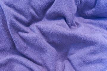 Fototapeta premium Crumpled blue fabric, background for work.