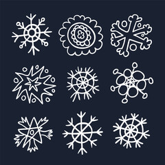 Snowflakes drawn in childish style linear icons set on black