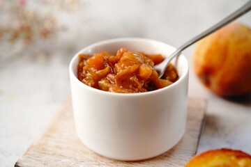 Homemade peach compote served in a bowl, selective focus