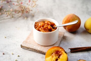 Homemade peach compote served in a bowl, selective focus
