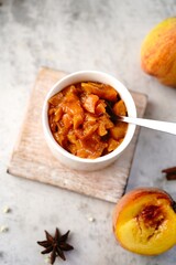 Homemade peach compote served in a bowl, selective focus