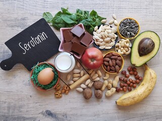 Fototapeta na wymiar Serotonin-boosting foods. Assortment of food for good mood, happiness, better memory, and positive mind. Healthy foods that may help boost serotonin. Natural sources of serotonin, healthy diet.