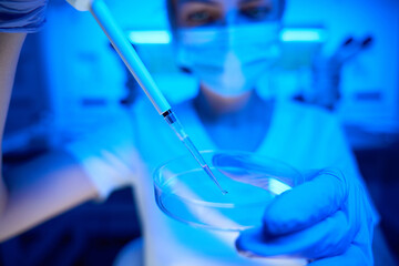 Scientist manipulates the biomaterial in a modern laboratory