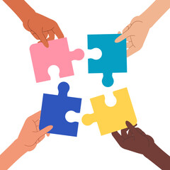 パズルピースを掲げた複数の手