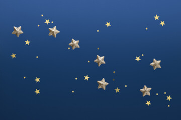 The constellation Ursa Major, lined with brilliant gold stars and confetti on a blue background