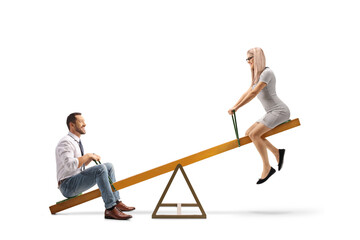 Couple playing on a seesaw