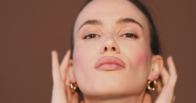 Unhappy girl standing looking in the mirror, checking dry irritated skin. Morning skincare routine. Beautiful girl with not smooth skin crushes red acne on her face. Woman checking skin problem.