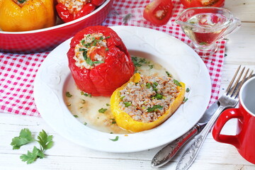 Stuffed peppers with minced meat and rice on a white background