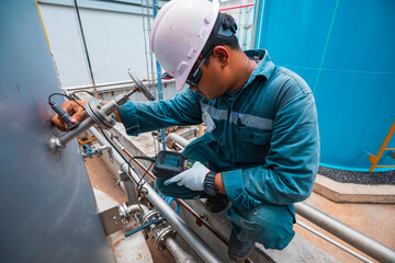 Male workers are for inspection of ultrasonic thickness nozzles pipe of stainless steel