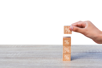 Hand stacking wooden blocks as symbol of increase with percentage symbol. concept of financial goals and interest rates Isolated on white background. PNG