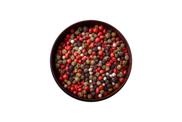 Spice allspice of different colors pink, white, green not ground in a wooden saucer