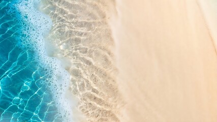 Fototapeta na wymiar abstract sand beach from above with light blue transparent water wave and sun lights, summer.