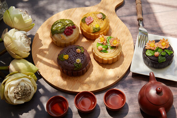 Mid Autumn Moon Cake on the wooden board under sunlight 