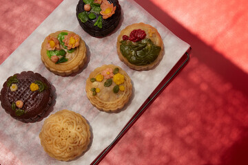 Mid-Autumn Festival food moon cake and tea on red background