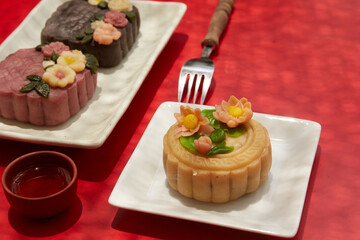 Mid-Autumn Festival food moon cake and tea on red background