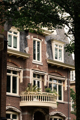 A typical residential building in Amsterdam, the Netherlands, a beautiful specimen of architecture, balcony
