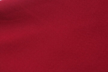 Piece of luxurious red satin fabric suitable for a textured background