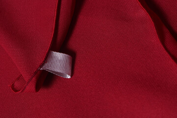 Piece of luxurious red satin fabric suitable for a textured background