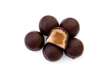 Pile of chocolate sweet with caramel filling isolated on a white background.