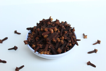 Dried clove or he aromatic flower buds of Syzygium aromaticum, spice from Indonesia. In a small...