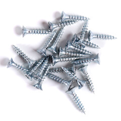 Chrome screw on white background. Tapping screws from steel close-up