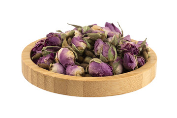 dried pink roses in a wooden bowl