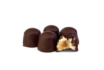 Pile of chocolate sweet with caramel filling isolated on a white background.
