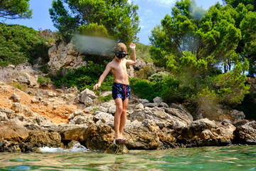 Boy spending summer vacation by water