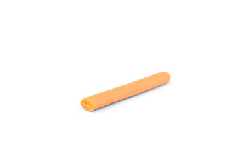 Orange chewable candy sticks isolated on a white background.