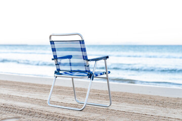 chair watching the sea on the sand 