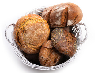 Basket with different kinds of bread Top view. Isolate on white background