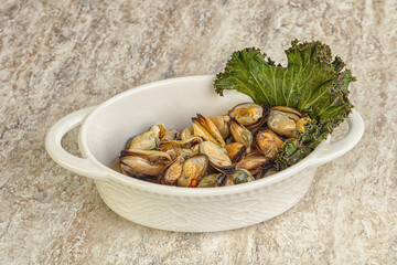 Tasty marinated mussels in the bowl